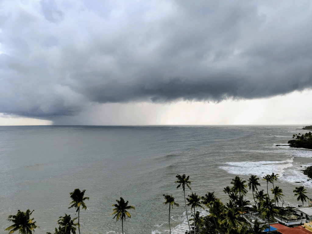 The sky, pregnant with rain, moments before the downpour. A view from Thangassery Lighthouse.