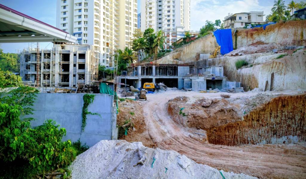 Hilly areas scraped down for construction. 