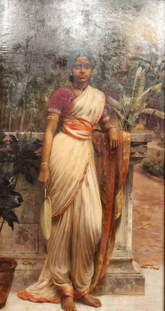 The painting 'Lady with a Fan' by Raja Ravi Varma