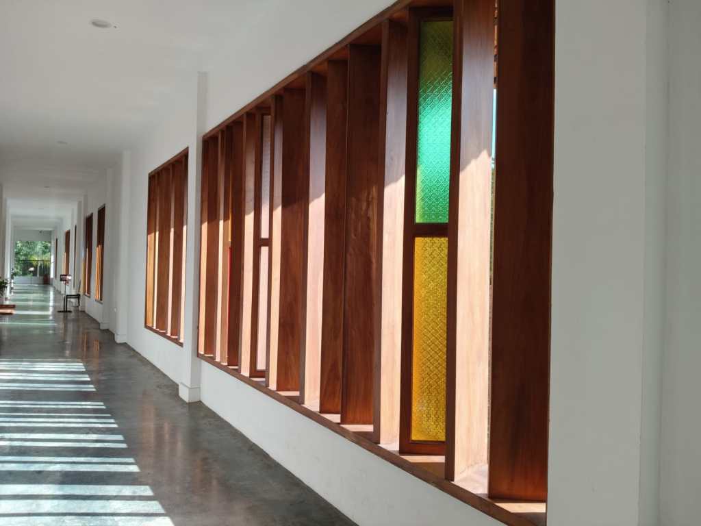 Long windows inside Raja Ravi Varma Art Gallery - colors, lights, and shadows.